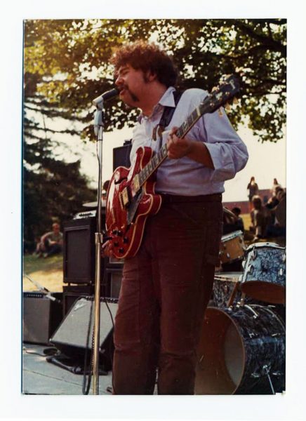 Mike Robillard on stage with the original four piece Roomful of Blues at the Vietnam Moratorium Day gathering in Wilcox Park, Westerly, Rhode Island, October 15, 1969 (Image appears courtesy the Larry and Linda Peduzzi Collection)