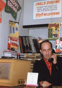 Carl Henry behind the counter at the original Carl's Diggins shop adjacent to The Celebrity Club. (Schiavino Family Archive)